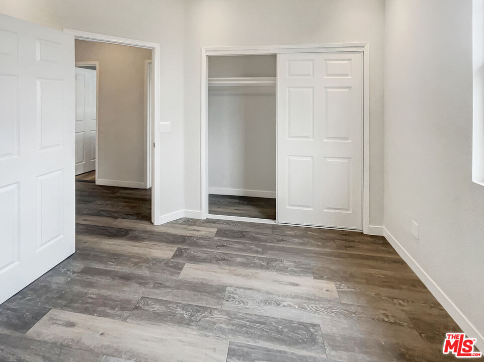 125 Lakeside Drive Buena Park, CA 90621 - Photo 53 of 57 an empty room with wooden floor