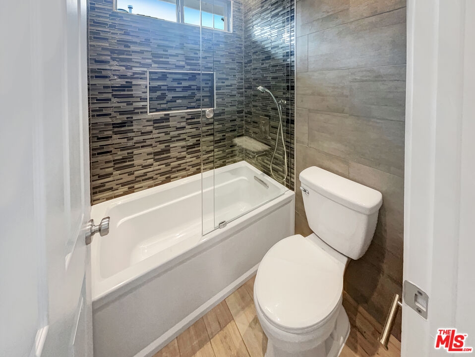 125 Lakeside Drive Buena Park, CA 90621 - Photo 55 of 57 a white toilet sitting next to a bath tub