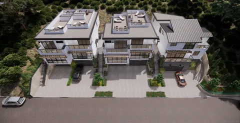 an aerial view of a house with garden and parking