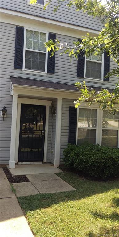 8804 Old Potters Road Charlotte, NC 28269 - Photo 2 of 12 a front view of a house with a yard and garage