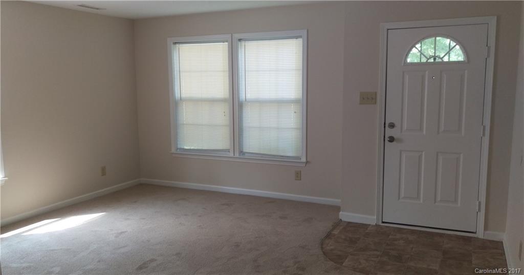 8804 Old Potters Road Charlotte, NC 28269 - Photo 3 of 12 an empty room with windows and closet