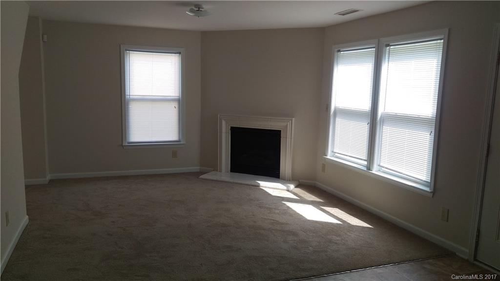 8804 Old Potters Road Charlotte, NC 28269 - Photo 6 of 12 an empty room with windows