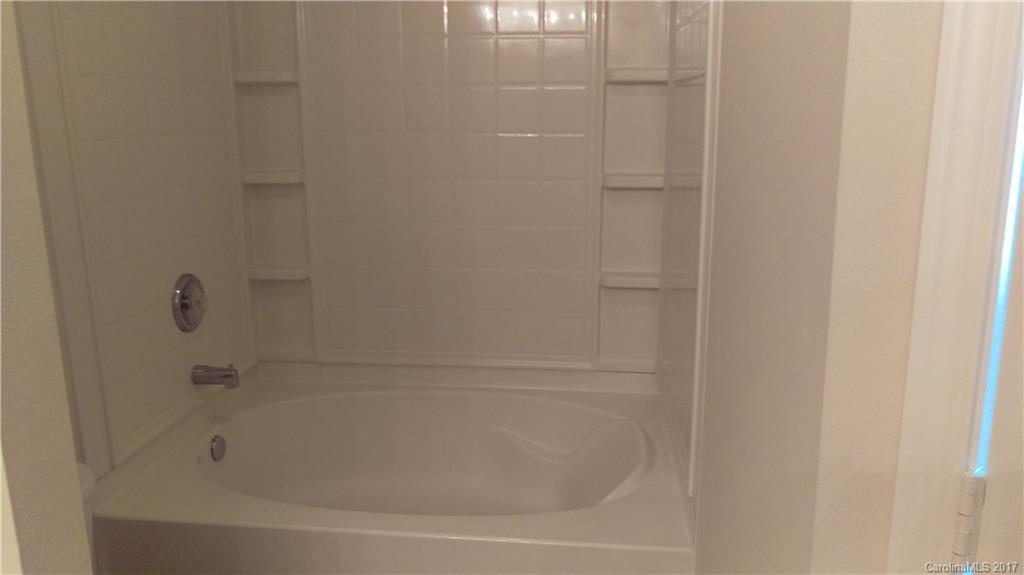 8804 Old Potters Road Charlotte, NC 28269 - Photo 10 of 12 a close up of a bathtub