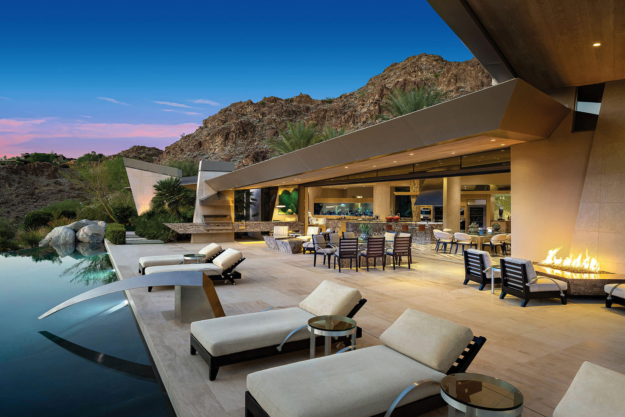 642 Pinnacle Crest Palm Desert, CA 92260 - Photo 16 of 29 a view of a patio with dining table and chairs with a patio