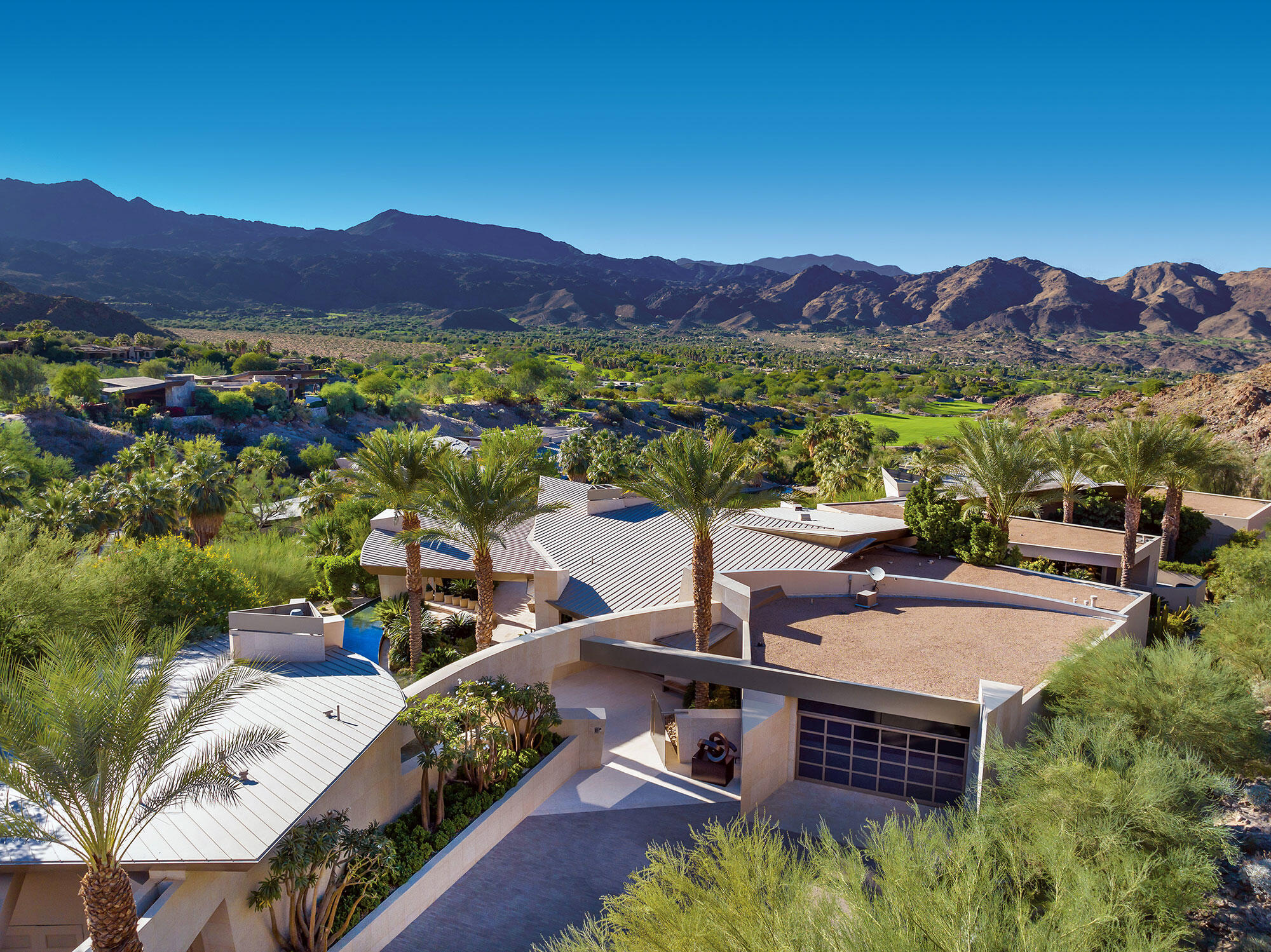 642 Pinnacle Crest Palm Desert, CA 92260 - Photo 2 of 29 an aerial view of a house with garden