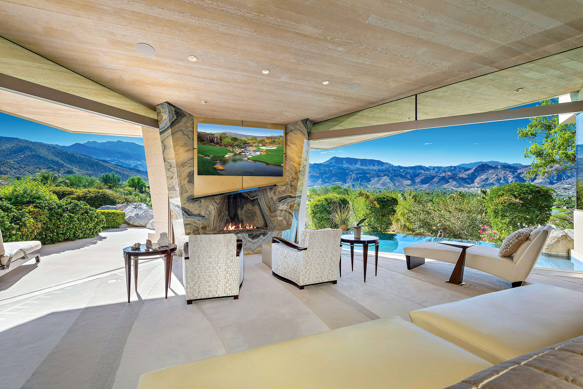 642 Pinnacle Crest Palm Desert, CA 92260 - Photo 21 of 29 a view of a patio with a table and chairs