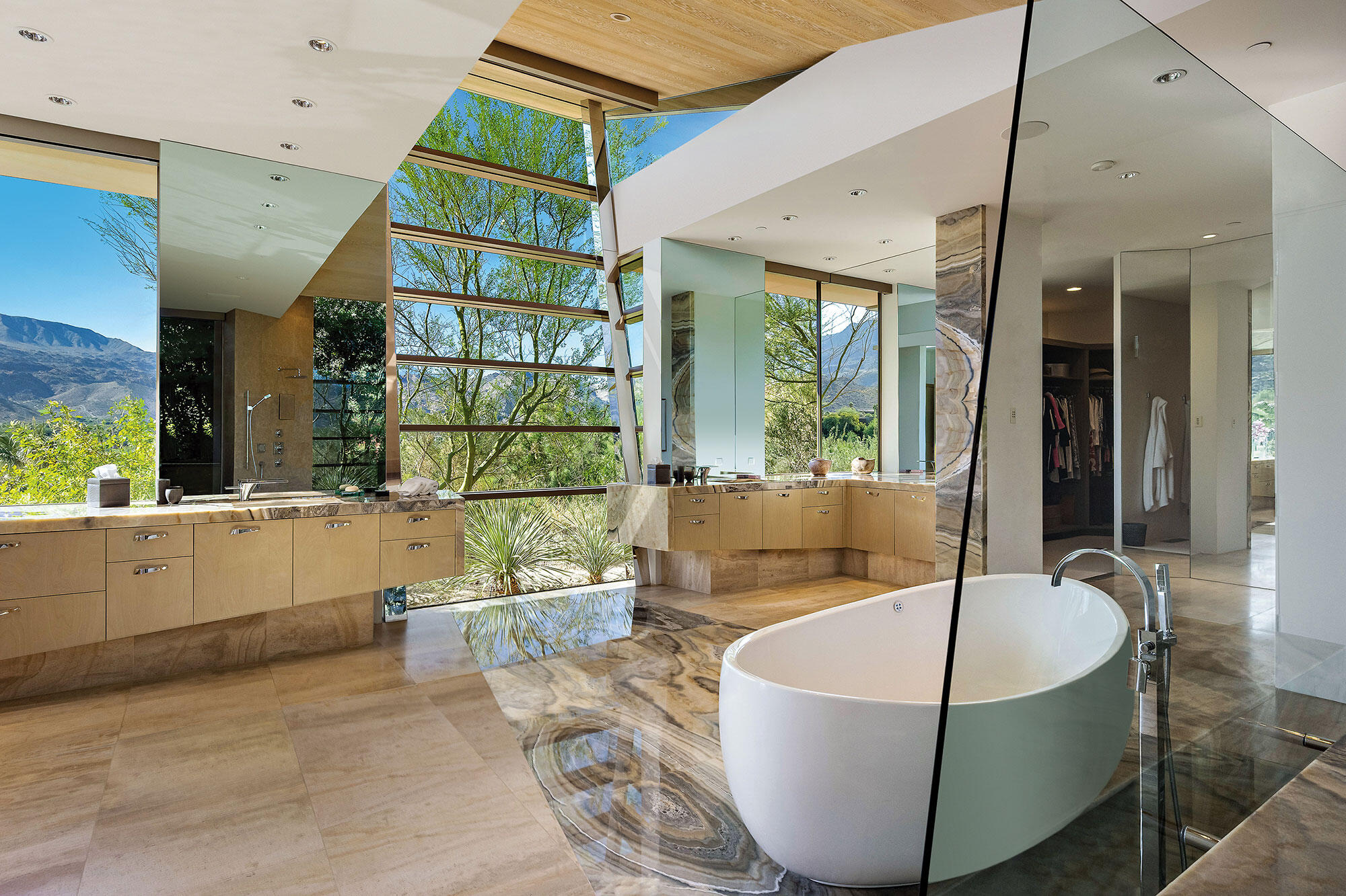 642 Pinnacle Crest Palm Desert, CA 92260 - Photo 24 of 29 a living room with a couch a dining table and a large window
