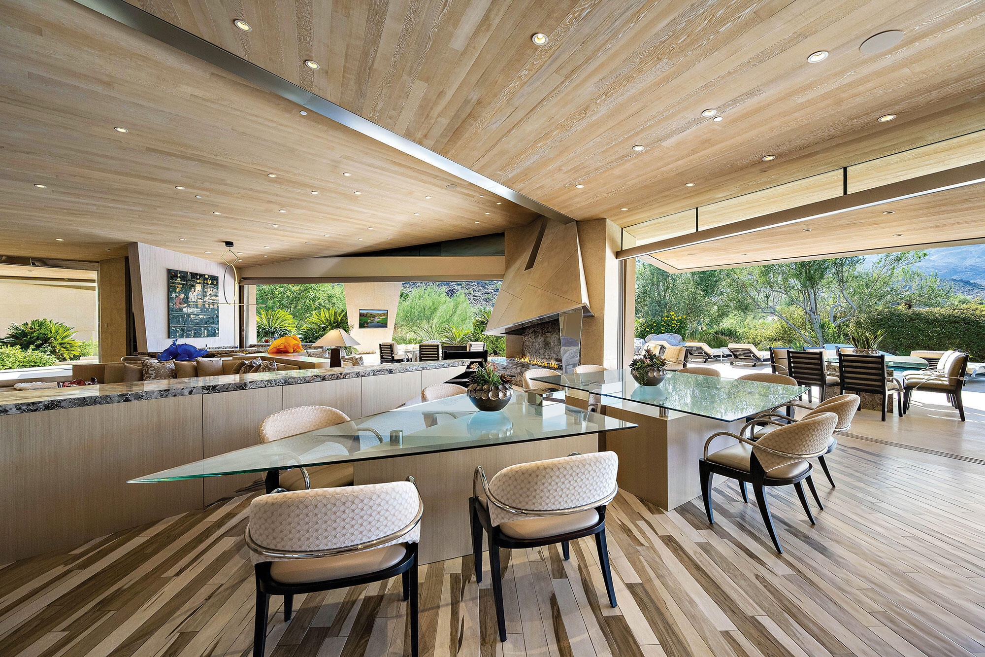 642 Pinnacle Crest Palm Desert, CA 92260 - Photo 10 of 29 a kitchen with a table chairs and flat screen tv