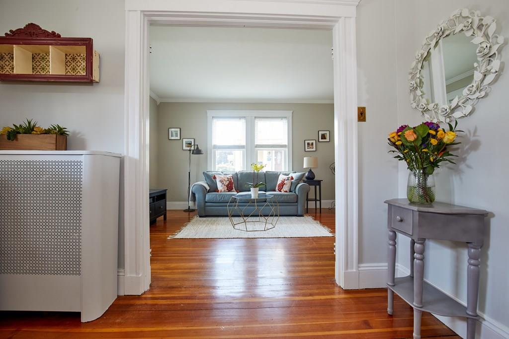 202 Metropolitan Avenue Boston, MA 02131 - Photo 17 of 31 a living room with furniture flowerpot and wooden floor