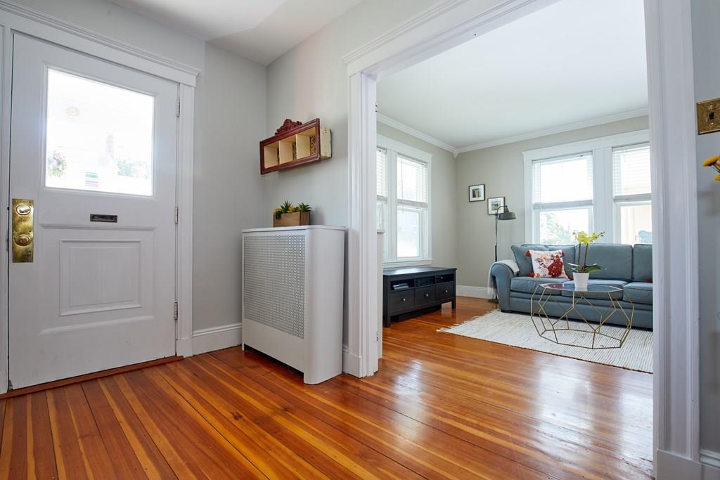 202 Metropolitan Avenue Boston, MA 02131 - Photo 18 of 31 a living room with furniture and a wooden floor
