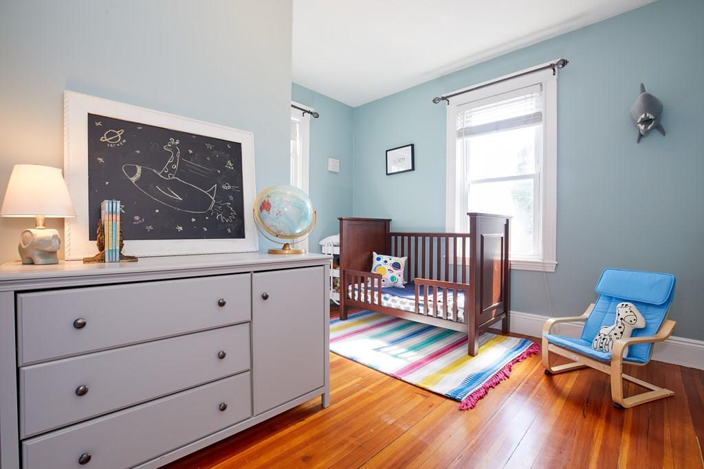 202 Metropolitan Avenue Boston, MA 02131 - Photo 19 of 31 a living room with furniture and a window