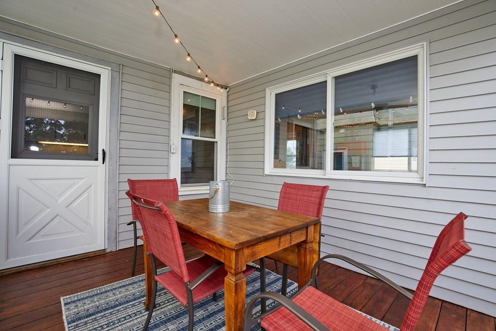 202 Metropolitan Avenue Boston, MA 02131 - Photo 26 of 31 a view of a dining room with furniture and wooden floor