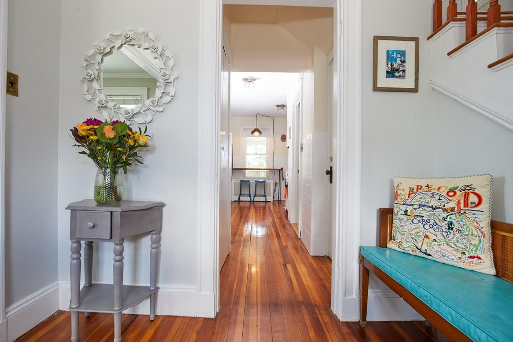 202 Metropolitan Avenue Boston, MA 02131 - Photo 5 of 31 wooden floor in a gallery with a mirror
