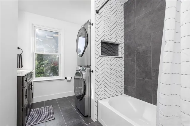 a bathroom with a double vanity sink and a window