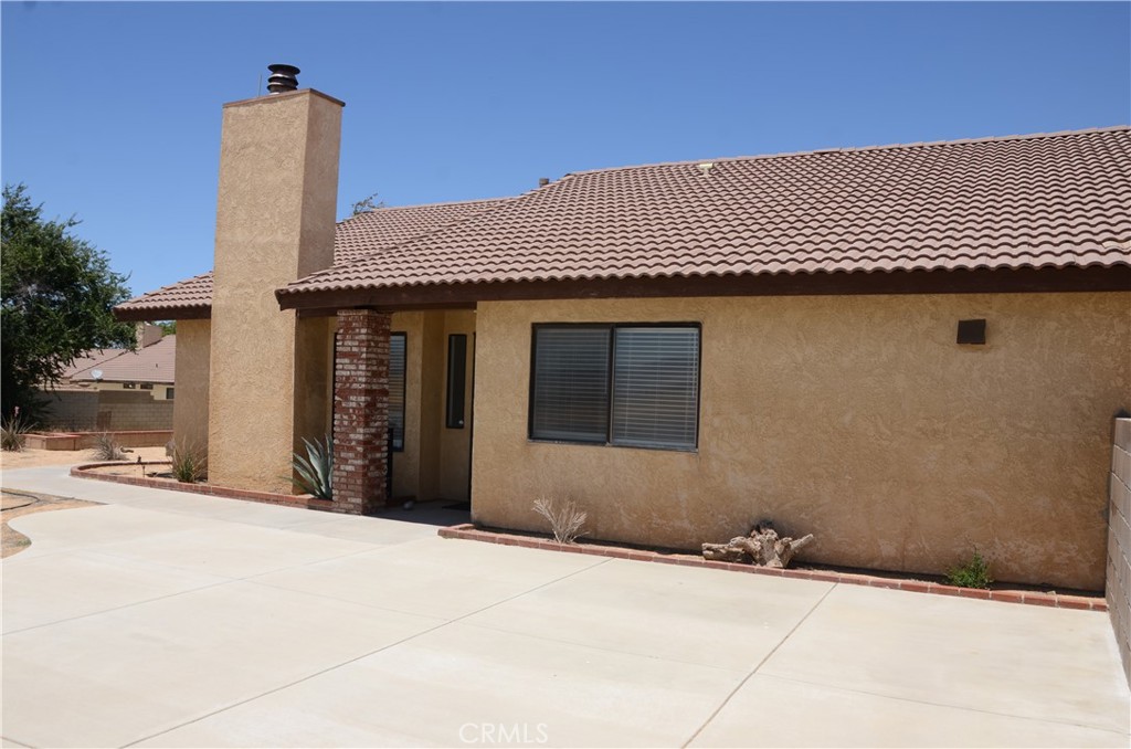 43600 Santa Rosa Circle Lancaster, CA 93535 - Photo 9 of 25 a front view of a house with a yard