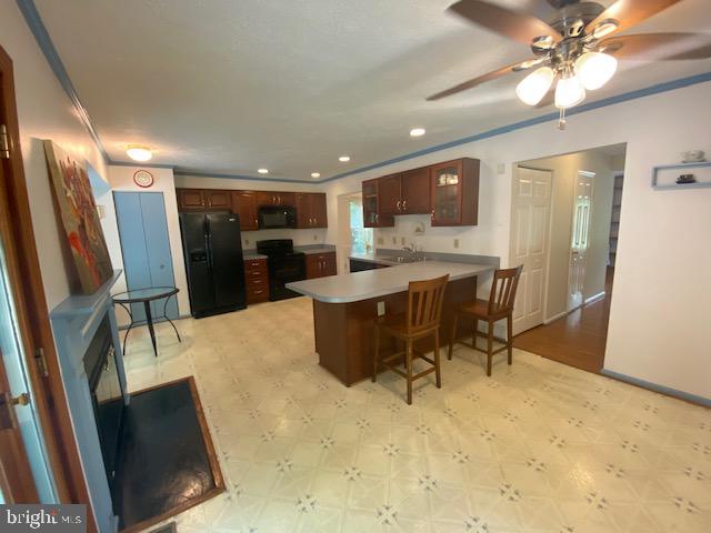 1718 Ballenger Creek Point Point of Rocks, MD 21777 - Photo 12 of 45 a living room with stainless steel appliances kitchen island granite countertop furniture and a refrigerator