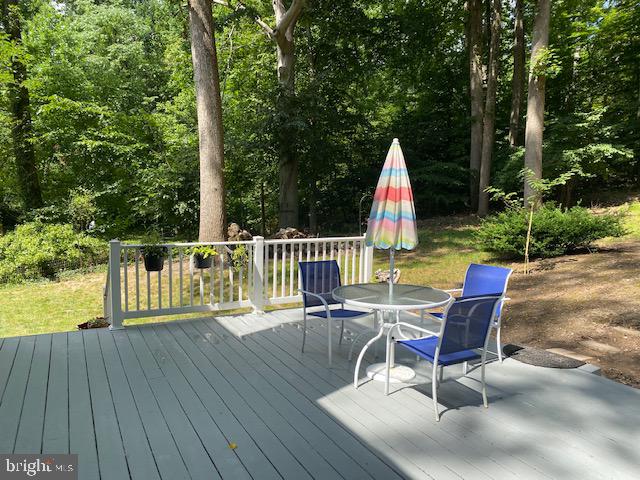 1718 Ballenger Creek Point Point of Rocks, MD 21777 - Photo 17 of 45 a view of a chair and table on the wooden deck