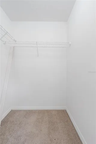 a view of a room with shelf in it