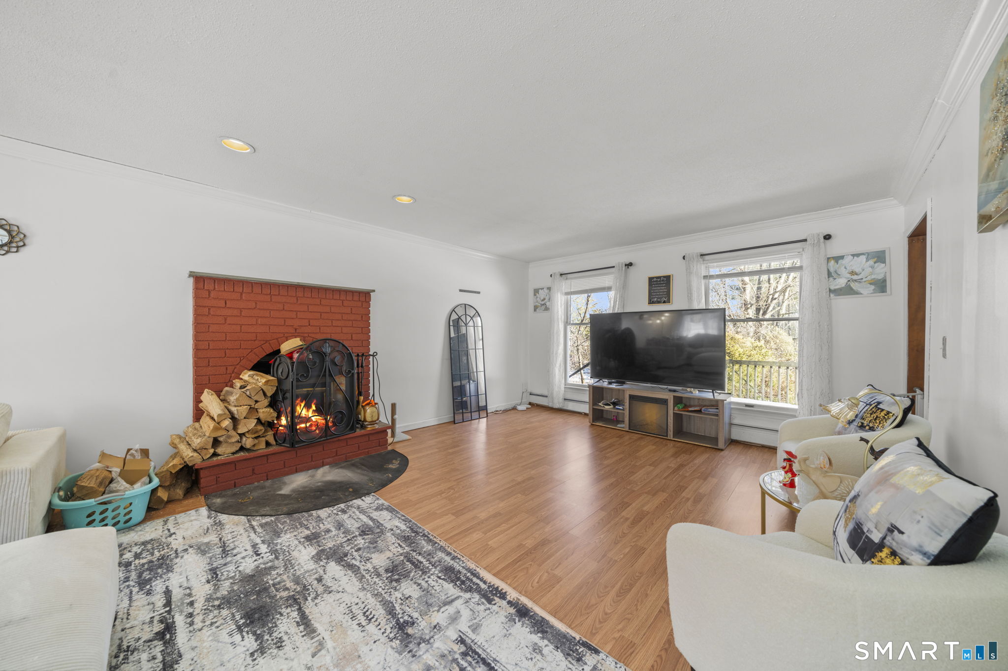 184 Black Hill Road Plainfield, CT 06374 - Photo 13 of 39 a living room with furniture and a flat screen tv