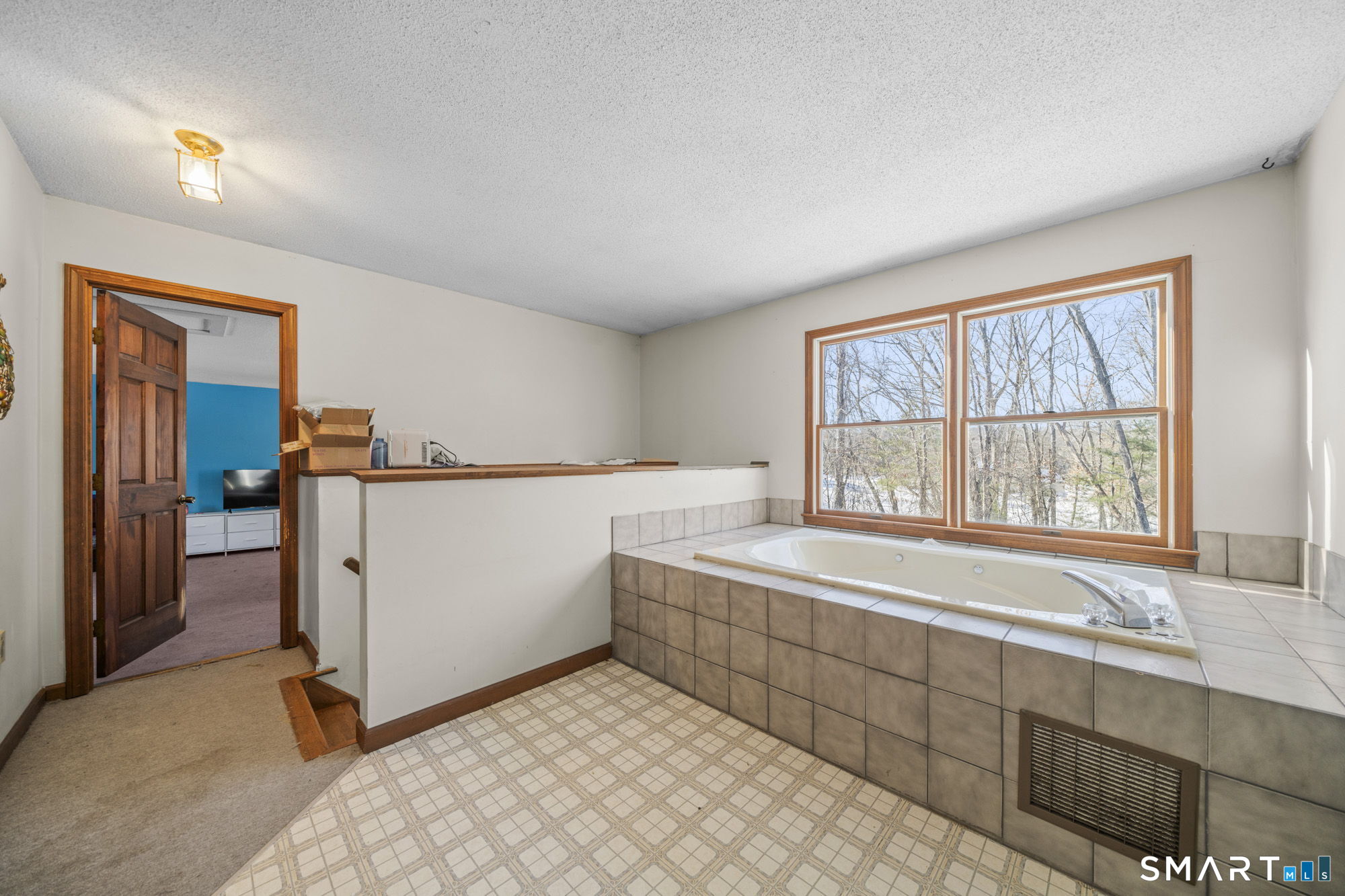 184 Black Hill Road Plainfield, CT 06374 - Photo 16 of 39 a room with a bed and a large window