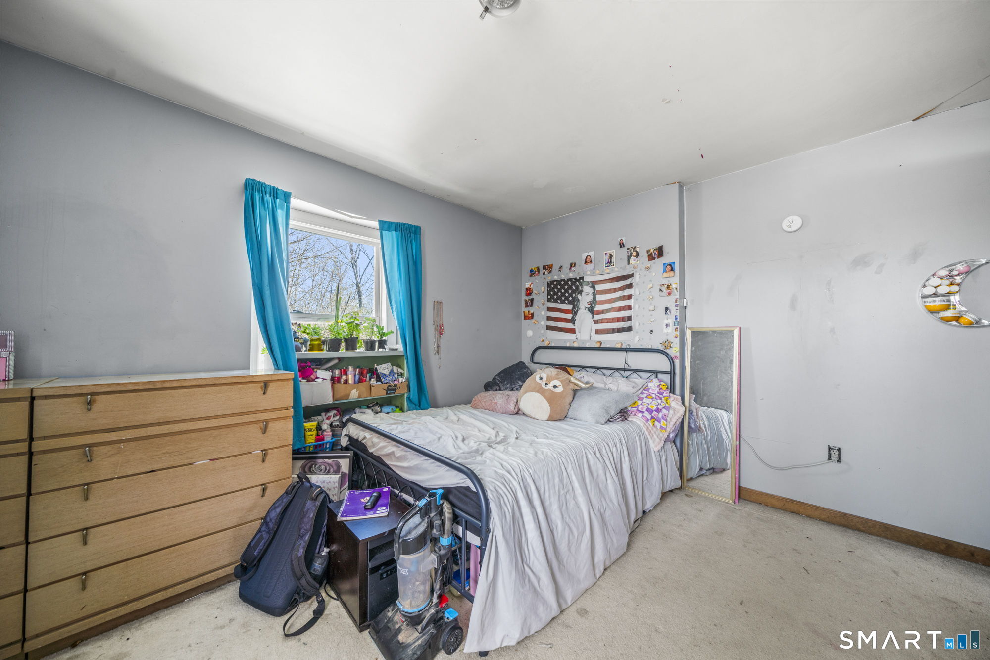 184 Black Hill Road Plainfield, CT 06374 - Photo 19 of 39 a bedroom with a bed a dresser and next to a window