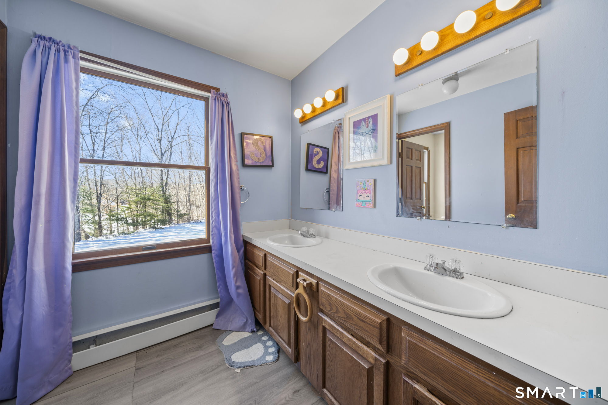 184 Black Hill Road Plainfield, CT 06374 - Photo 27 of 39 a spacious bathroom with a sink double vanity and a mirror