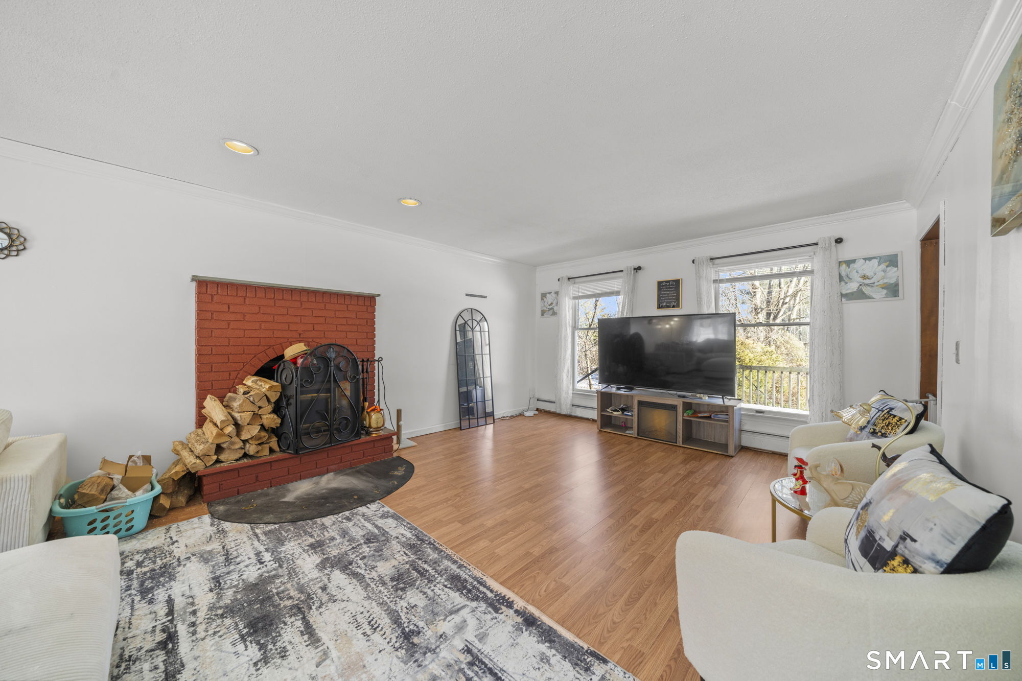 184 Black Hill Road Plainfield, CT 06374 - Photo 10 of 39 a living room with furniture and a flat screen tv