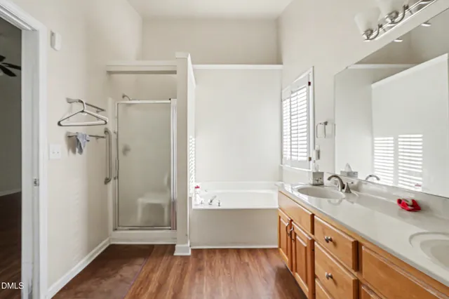 a bathroom with a sink a mirror and a bathtub