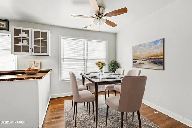 a dining room with furniture and window