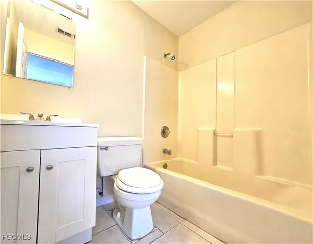 a bathroom with a toilet a sink and a bathtub