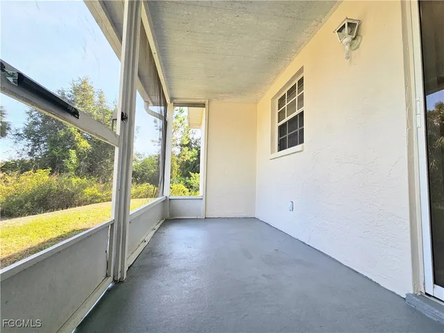 a view of a room with a large window