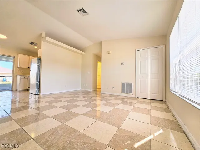 a view of an empty room and window