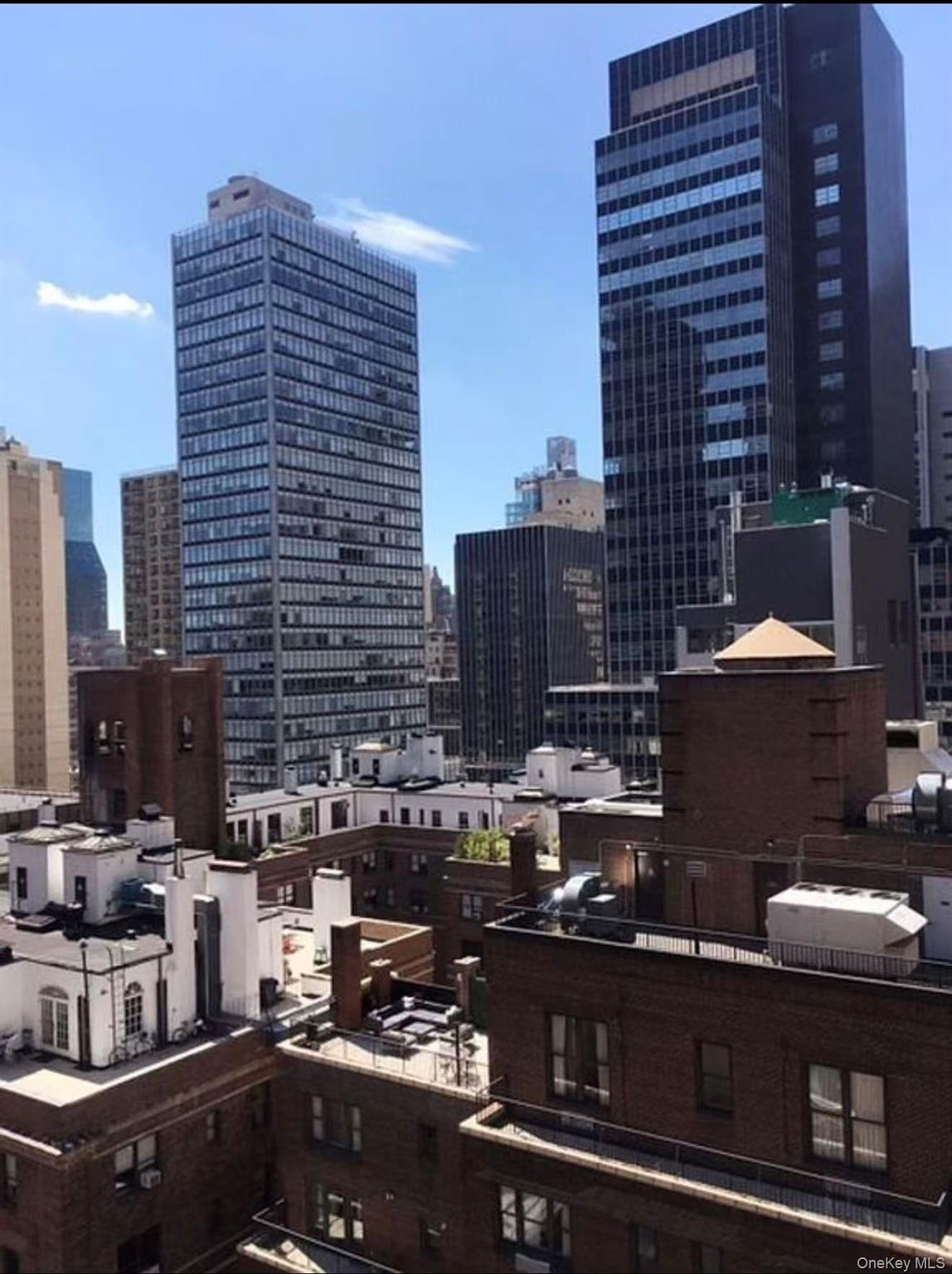 145 East 48th Street, Unit 22C Manhattan, NY 10017 - Photo 2 of 11 a picture of a city view