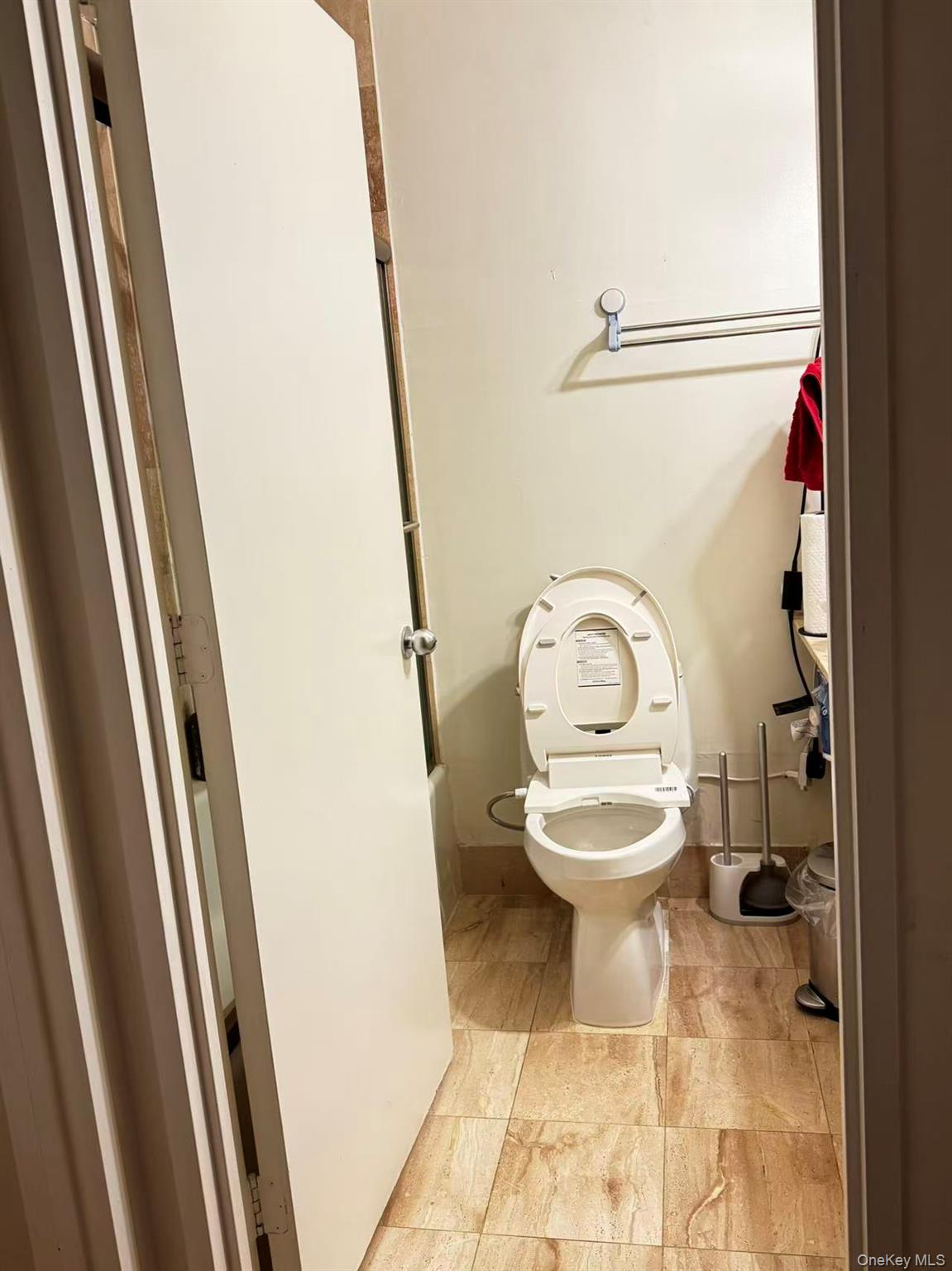145 East 48th Street, Unit 22C Manhattan, NY 10017 - Photo 8 of 11 a bathroom with a toilet and a rug