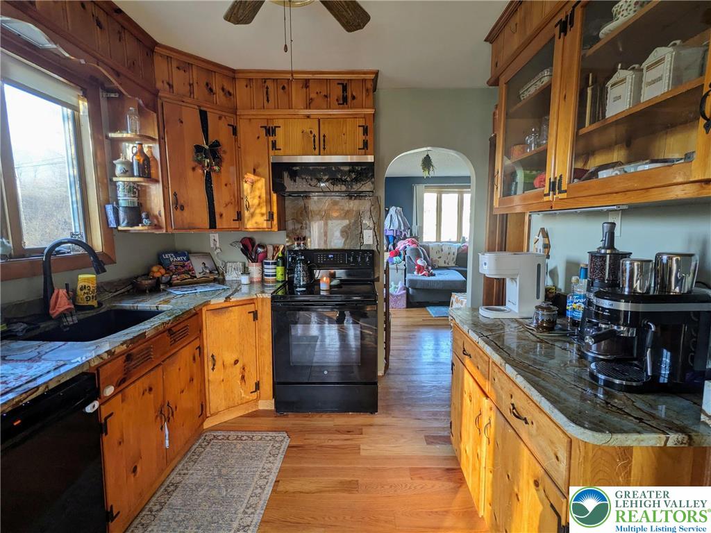 538 Belfast Road Nazareth, PA 18064 - Photo 15 of 25 a kitchen with stainless steel appliances granite countertop a stove a sink and a microwave