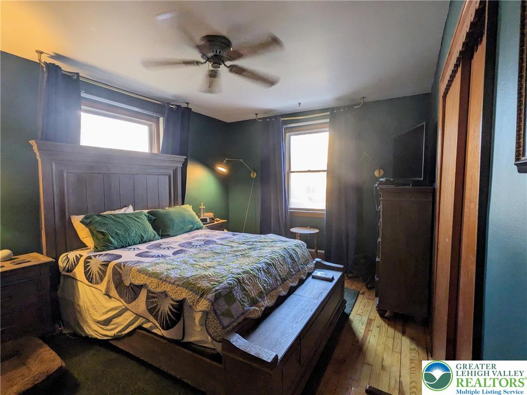 538 Belfast Road Nazareth, PA 18064 - Photo 19 of 25 a bedroom with a bed and a chandelier