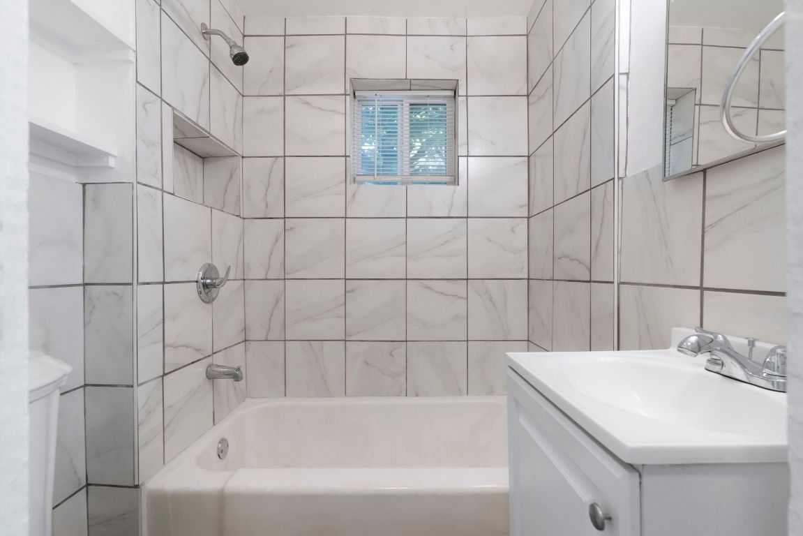 1606 Maple Avenue Austin, TX 78702 - Photo 12 of 15 a bathroom with a sink and vanity