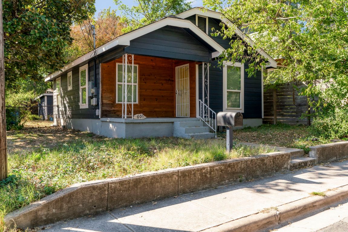 1606 Maple Avenue Austin, TX 78702 - Photo 2 of 15 a front view of a house with a yard table and chairs