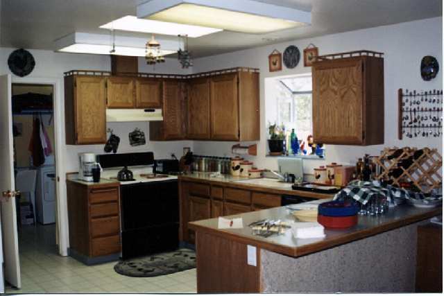 4046 Cimarron Road, Unit 1 Fallon, NV 89406 - Photo 2 of 6 a kitchen with stainless steel appliances kitchen island granite countertop a sink stove and refrigerator