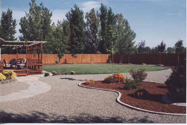 4046 Cimarron Road, Unit 1 Fallon, NV 89406 - Photo 5 of 6 a backyard of a house with table and chairs