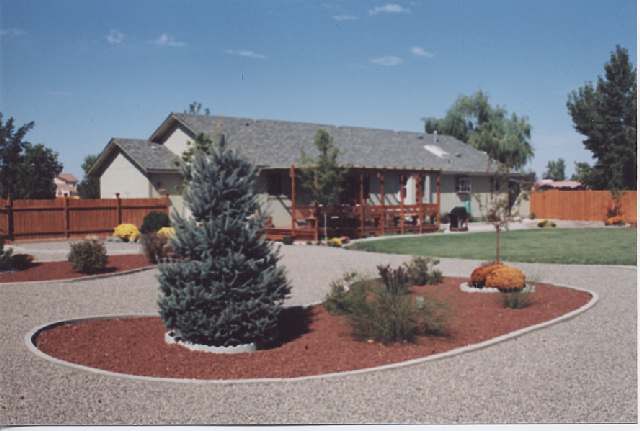 4046 Cimarron Road, Unit 1 Fallon, NV 89406 - Photo 6 of 6 a view of a house with a yard potted plants