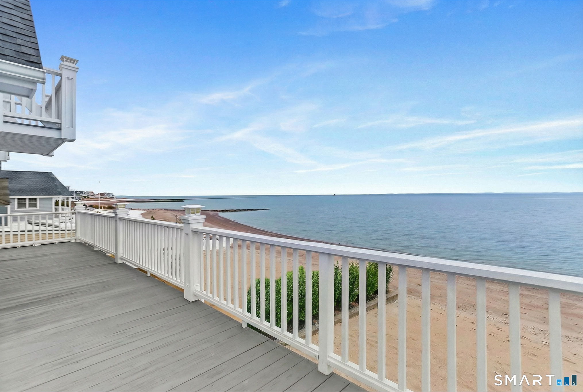 1149 Fairfield Beach Road Fairfield, CT 06824 - Photo 22 of 40 a balcony with an ocean view