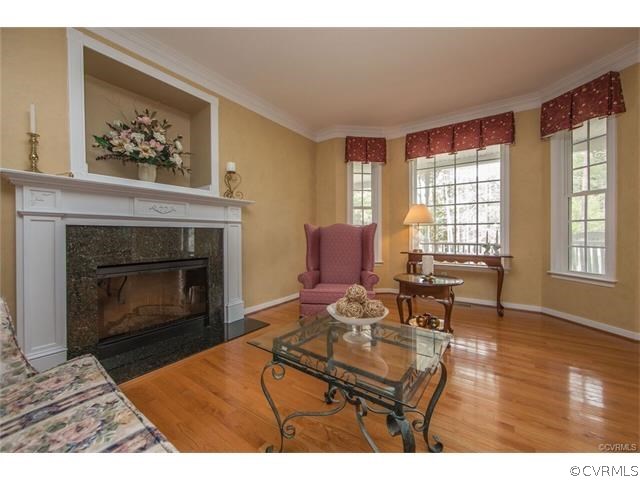 14313 Princess Mary Road Chesterfield, VA 23838 - Photo 11 of 48 a living room with furniture a window and a fireplace