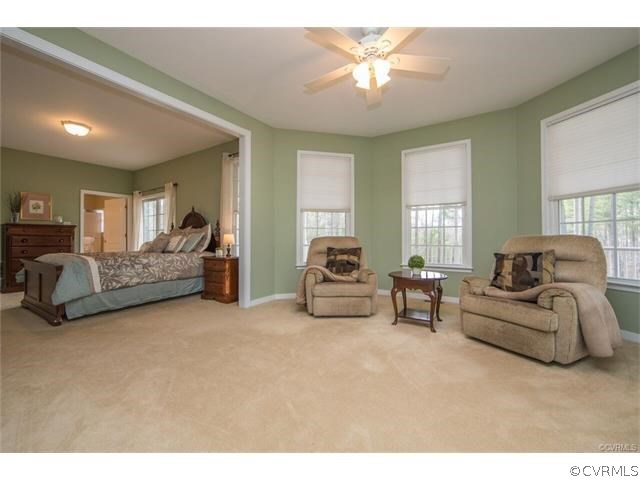 14313 Princess Mary Road Chesterfield, VA 23838 - Photo 16 of 48 a living room with furniture and a chandelier