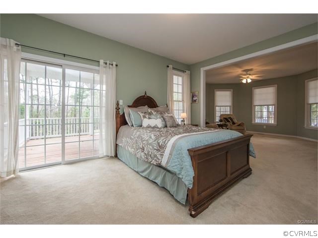 14313 Princess Mary Road Chesterfield, VA 23838 - Photo 18 of 48 a bedroom with a large bed and a large window