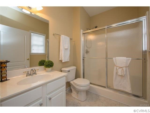 14313 Princess Mary Road Chesterfield, VA 23838 - Photo 19 of 48 a bathroom with a sink toilet a mirror and shower