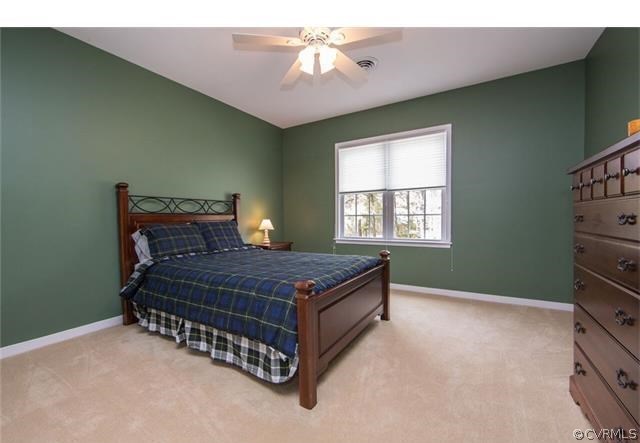 14313 Princess Mary Road Chesterfield, VA 23838 - Photo 27 of 48 a bed sitting in a room next to a window