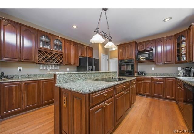 14313 Princess Mary Road Chesterfield, VA 23838 - Photo 5 of 48 a kitchen with stainless steel appliances granite countertop counter space a sink cabinets and wooden floor
