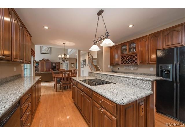 14313 Princess Mary Road Chesterfield, VA 23838 - Photo 6 of 48 a kitchen with stainless steel appliances granite countertop a sink dishwasher a stove and a refrigerator with wooden floor