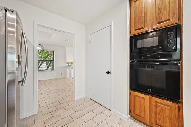 a view of a kitchen from the hallway
